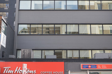 Fototapeta premium Tim Hortons coffee shop and Canada Post office on Yonge St, Toronto