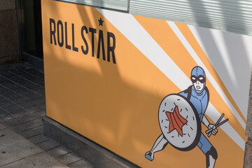 Fototapeta premium comics illustration sign outside Rollstar Sushi, a Japanese restaurant, located at 946 Yonge St inside The Memphis, Toronto
