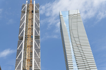 Fototapeta premium (left) One Bloor West (by Foster + Partners, with CORE Architects) and (right) One Bloor East (Hariri Pontarini Architects) at the intersection of Yonge, shown here south elevations, Toronto
