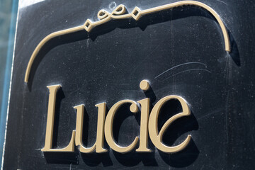 Fototapeta premium sign outside Lucie, a restaurant, located at 100 Yonge St, Toronto