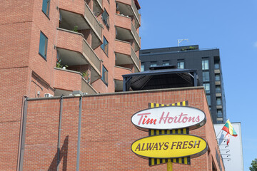 Fototapeta premium retro sign in parking lot at Tim Hortons, a coffee shop chain, located here at 1728 Bloor St W at Indian Grove, Toronto