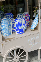Fototapeta premium flower cart with decorative paper vases in front of a flower shop in Toronto (possibly Berry Blush, 1960 Yonge St)