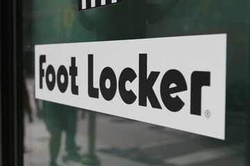 Fototapeta premium close-up of Foot Locker, a major global retail chain that specializes in athletic footwear, sportswear, and casual street fashion, located here at 2 Queen Street West, a special event space, Toronto
