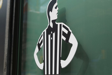 Fototapeta premium close-up of Foot Locker ref logo, a major global retail chain that specializes in athletic footwear, sportswear, and casual street fashion, located here at 2 Queen St W, a special event space, Toronto