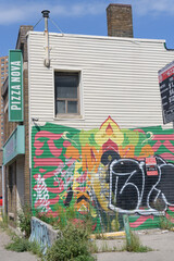 Fototapeta premium exterior view of Pizza Nova, a pizza restaurant chain, located here at 2265 Dundas St W, Toronto