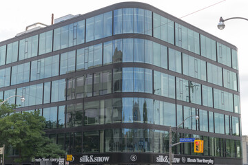 Fototapeta premium new commercial building and sign of Silk & Snow, a mattress store, located at 1133 Yonge St, Toronto