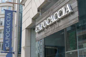 Fototapeta premium exterior building facade and sign of Capocaccia Trattoria, an Italian restaurant, located at 1366 Yonge St, Toronto