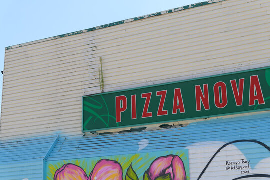 sign on the exterior of Pizza Nova, a pizza restaurant chain, located here at 2264 Dundas St W, Toronto