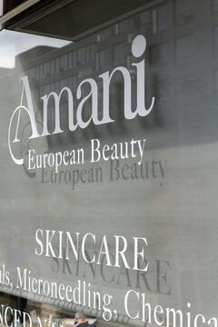exterior building window sign of Amani Skin Care & Permanent Makeup located at 1248 Yonge St in Summerhill, just south of St Clair, Toronto