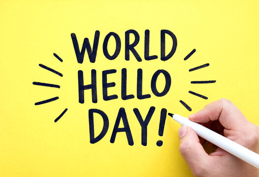 Handwriting world hello day greeting with marker on bright yellow background for celebrations