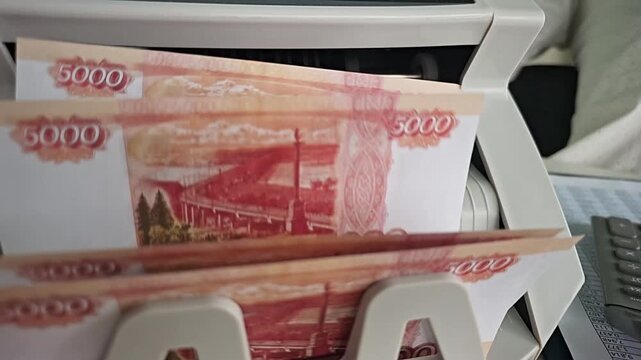Cash withdrawal at an ATM in the city during the afternoon