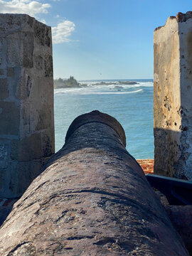 Cannon at Castillo San Felipe del Morro or el Morro in San Juan, Puerto Rico. Fortress by the sea. View of Fort&iacute;n San Juan de la Cruz or El Ca&ntilde;uelo, protecting the bay with crossfire.