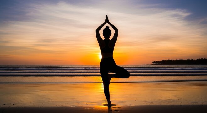 Woman practicing tree pose yoga on a beach at sunset. Mindfulness, balance, wellness and meditation concept with ocean horizon and peaceful natural background.