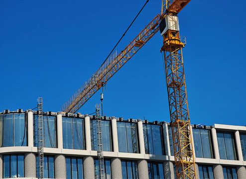 Construction crane building modern building city backdrop