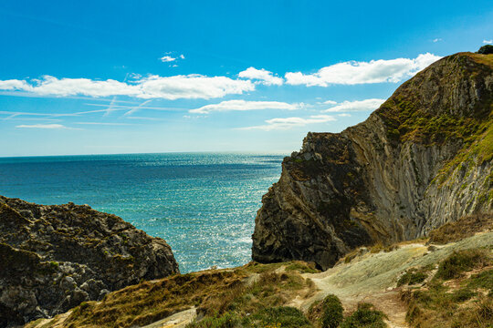 Rugged cliffs overlooking the turquoise sea on the Jurassic Coast in Dorset, England