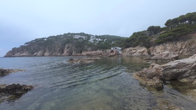 Rocky mediterranean coastline on a cloudy day