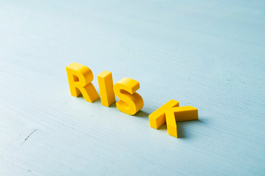 Business risk and uncertainty concept with unstable yellow letters