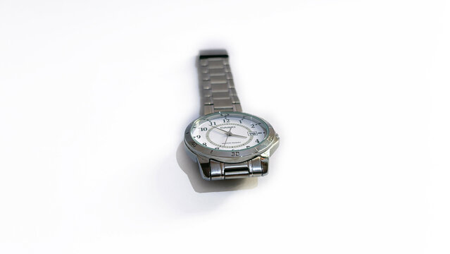 Kediri, East Java, Indonesia &ndash; August 16, 2026: Metallic Wristwatch with Dark Dial Photographed in Multiple Angles