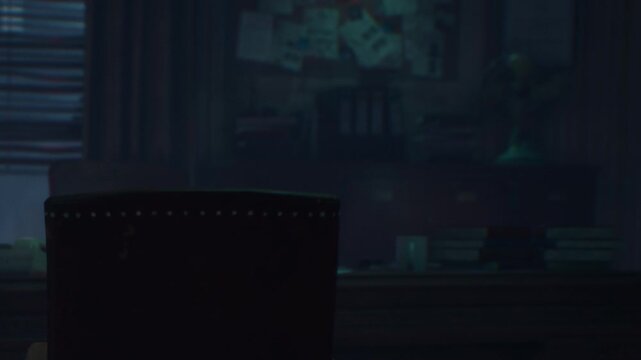 A chair sits empty in a dim room. A desk is visible with stacks of papers and a mug. The atmosphere feels quiet as shadows fill the space, creating a sense of stillness.