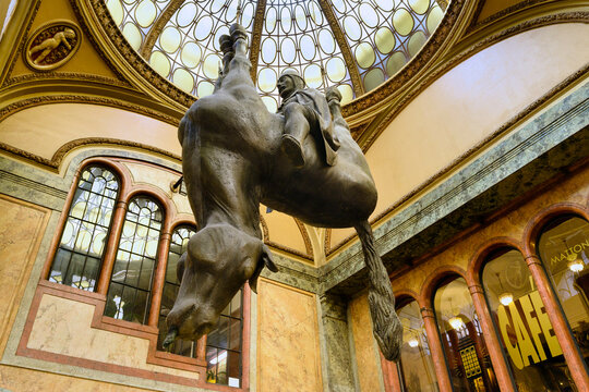 PRAGUE, CZECH REPUBLIC - AUGUST 2011: Famous provocative sculpture of King Wenceslas riding an upside-down dead horse by artist David Cerny inside the Lucerna Palace passage.