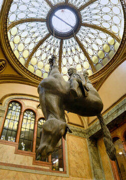 PRAGUE, CZECH REPUBLIC - AUGUST 2011: Famous provocative sculpture of King Wenceslas riding an upside-down dead horse by artist David Cerny inside the Lucerna Palace passage.