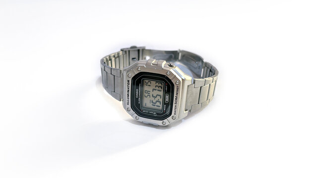 Kediri, East Java, Indonesia &ndash; August 16, 2026: Metallic Wristwatch with Rectangular Digital Face and Perforated Band Photographed on White Background