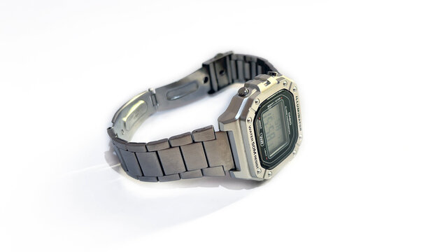 Kediri, East Java, Indonesia &ndash; August 16, 2026: Metallic Wristwatch with Rectangular Digital Face and Perforated Band Photographed on White Background