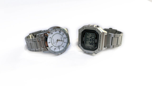 Kediri, East Java, Indonesia &ndash; August 16, 2026: Pair of Metallic Wristwatches with Light and Dark Dial Displayed Side by Side on White Background