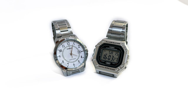 Kediri, East Java, Indonesia &ndash; August 16, 2026: Pair of Metallic Wristwatches with Light and Dark Dial Displayed Side by Side on White Background