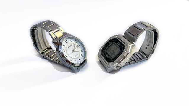 Kediri, East Java, Indonesia &ndash; August 16, 2026: Pair of Metallic Wristwatches with Light and Dark Dial Displayed Side by Side on White Background