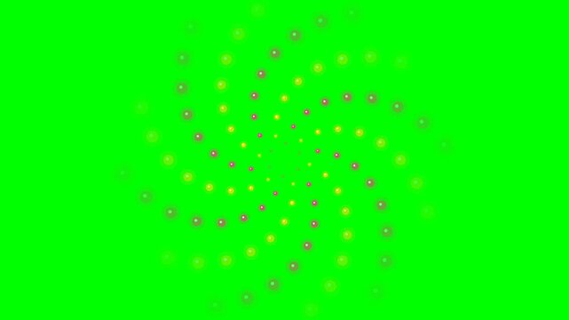 Abstract spiral pattern of glowing yellow and orange dots on green screen