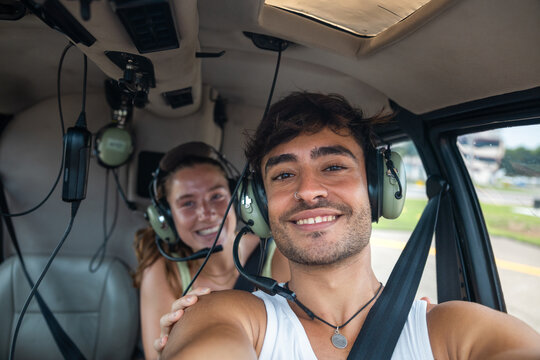 Couple taking a selfie inside a helicopter in Brazil