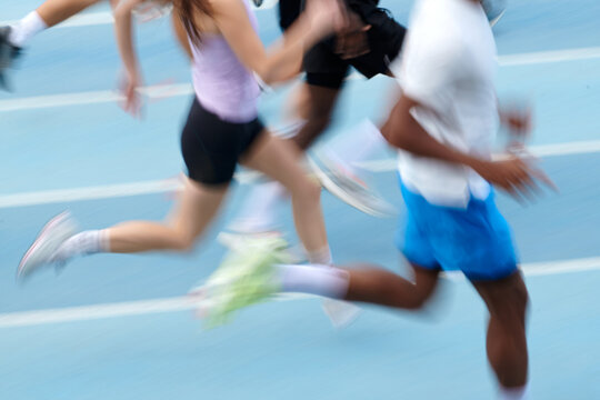 Motion blur photo of a Running Club athletes crop