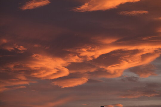 Abstract fiery sunset cloud formation over northern Italy