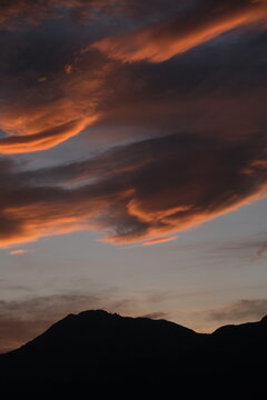 Vertical view of glowing sunset clouds in the evening sky