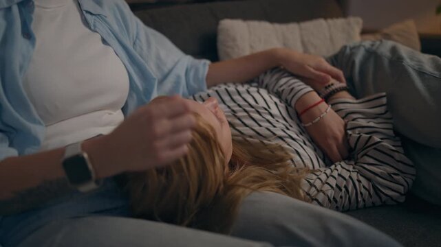 Mother and teenage daughter spending time together at home, sharing a supportive moment that represents communication, active listening, trust and family connection.