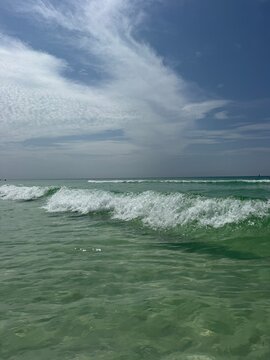 Emerald colored water of the Gulf of Mexico with rolling wave in Destin, Florida 