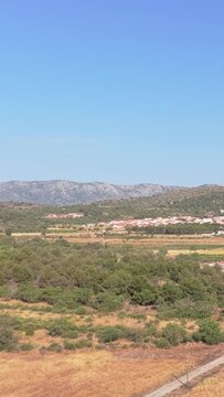 The rural landscape of Opoul Perillos, France, aerial vertical 9:16 view.