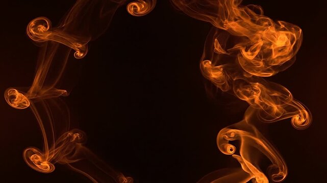Vibrant orange smoke plumes frame a dark atmospheric background for seamless Halloween loop motion graphics and seasonal holiday digital video editing projects.