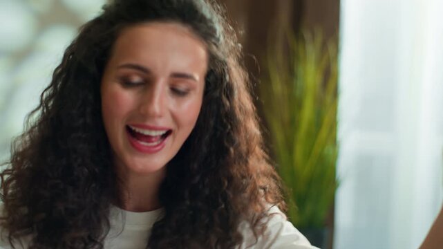 Happy pretty Caucasian woman dancing carefree fooling around having fun singing at home bedroom celebrating morning joyful female girl enjoy dance joy candid listening music sing with good mood indoor