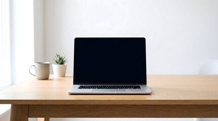 Fototapeta premium Eye-level shot of a laptop computer with blank screen representing remote work and digital presentation with copy space in a minimalist home office.