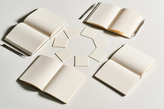 Collaborative Planning Table with Blank Notes and Notebooks