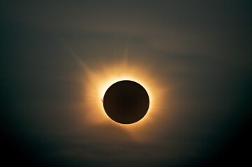 Total solar eclipse of 12 August 2026 at totality, glowing solar corona around the dark moon with...