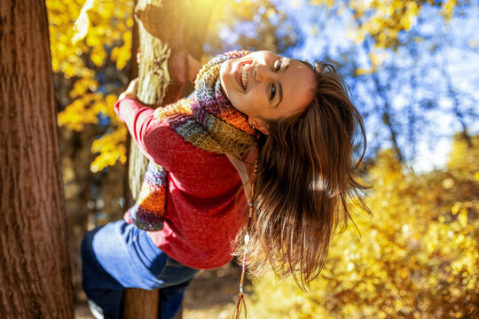Portrait of a beautiful smiling woman in autumn park