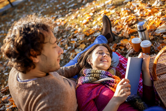 Close-up of loving couple relaxing in fall park