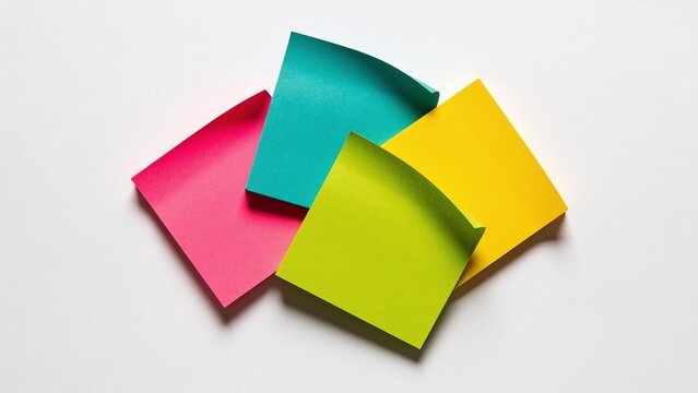 a minimalist and colorful layout of four square sticky notes arranged in a loose cluster against a plain white background. Each sticky note is distinct in color: one is bright pink, another is vibrant