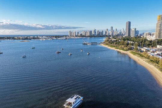 Aerial view of the Gold Coast Marathon Finish Line area along the Broadwater with boats anchored in the water and the Southport skyline in the background in Southport, Queensland, Australia.