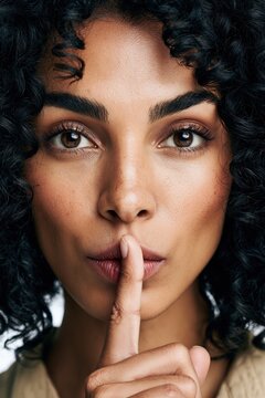 Woman requiring silence keeping a secret gesture