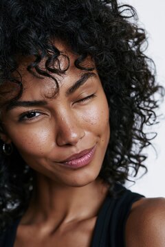 Winking woman expressing confidence and playfulness