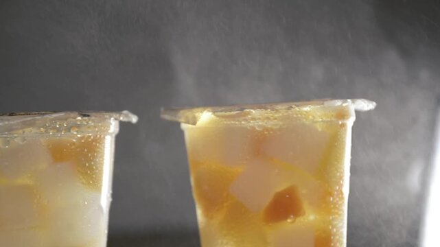 glass of fruit sachet on the fridge